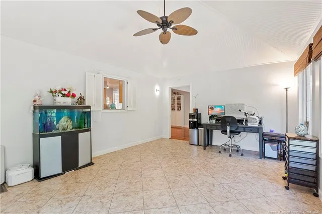 a view of a livingroom with furniture and a window