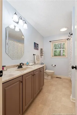 a room with a workspace and a window