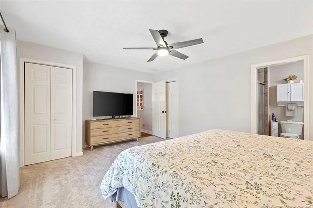 a bathroom with a sink toilet and a mirror
