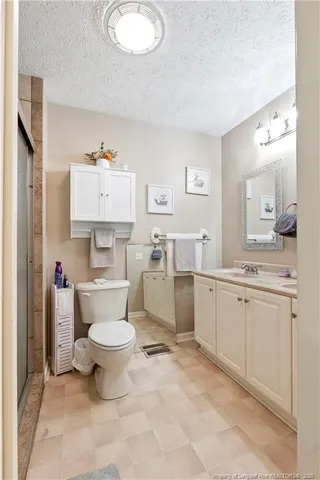 a view of room with workspace and hallway