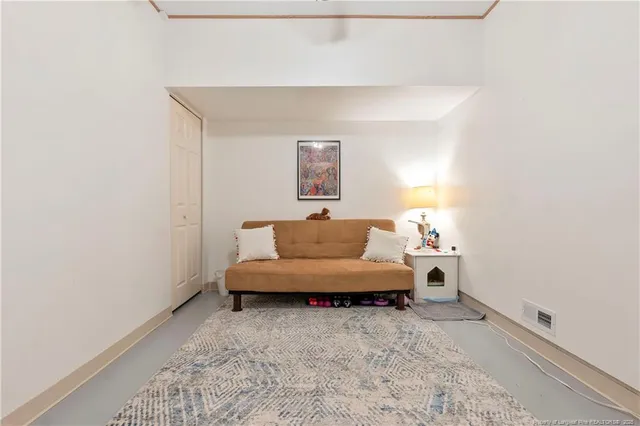 a view of a storage & utility room with a window