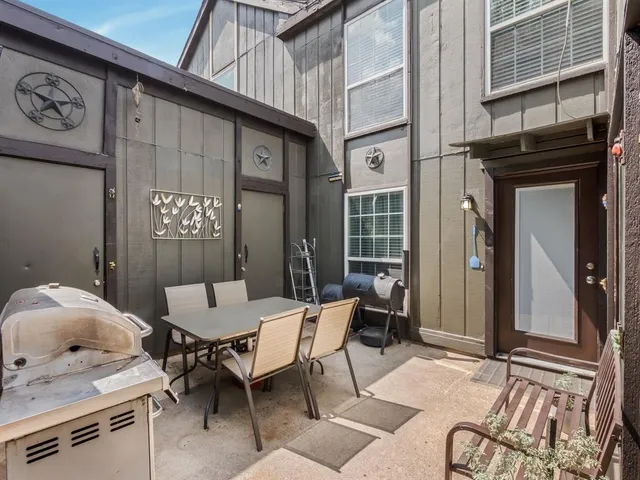 a outdoor space with a couch and chairs
