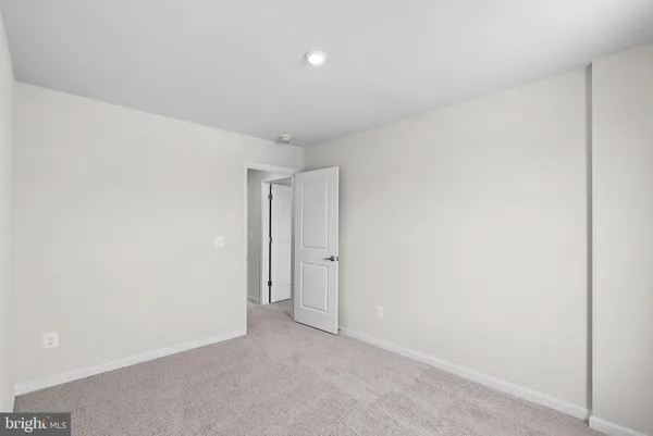 a room with a bed and a window