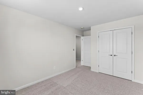 a bedroom with bed and a window