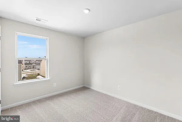 an empty room with closet area