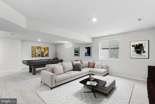 an empty room with a empty space and windows