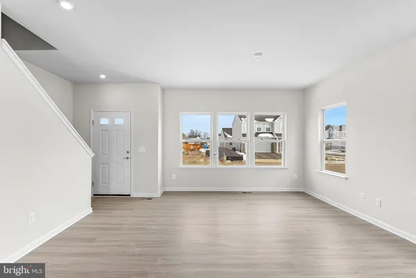a view of room with window and hardwood floor