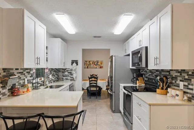 a kitchen with a sink and a window