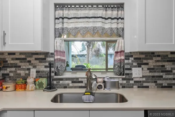 a kitchen with a stove and a microwave