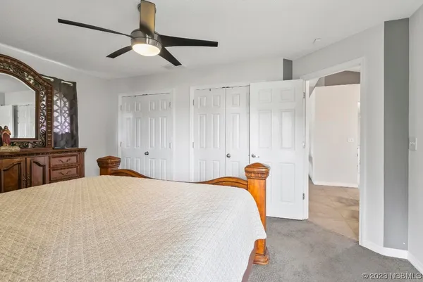 a bedroom with furniture and a window