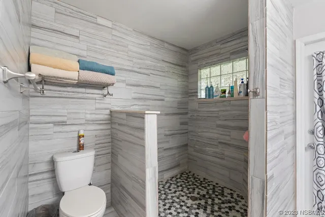 a view of a backyard with a garden and plants