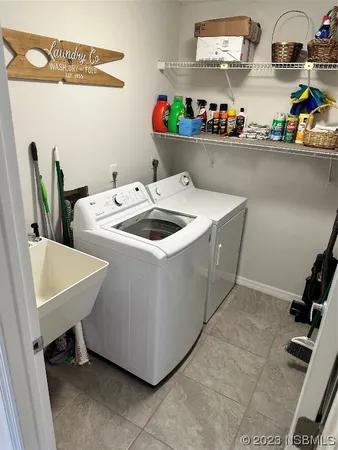 a view of a chair and table in the garden