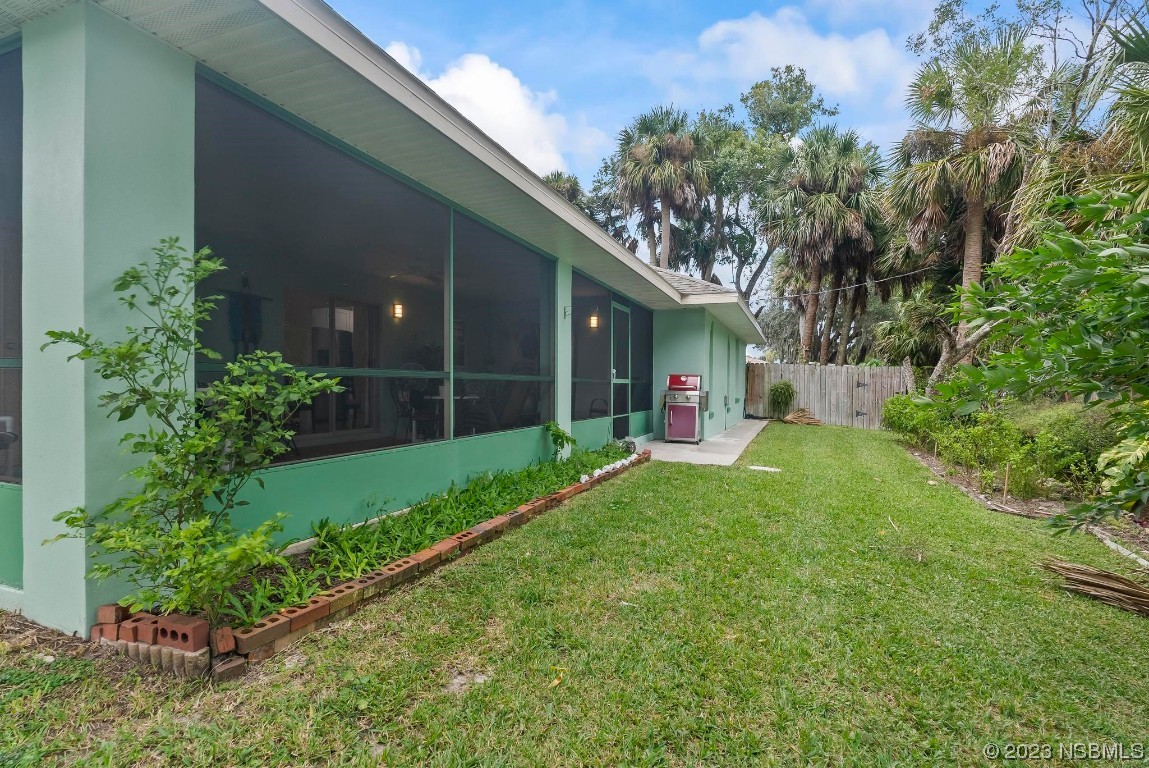 1829 Lime Tree Drive Edgewater, FL 32132 - Photo 39 of 62 a view of an house with backyard and garden