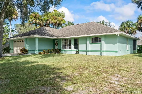 a house with trees in front of it