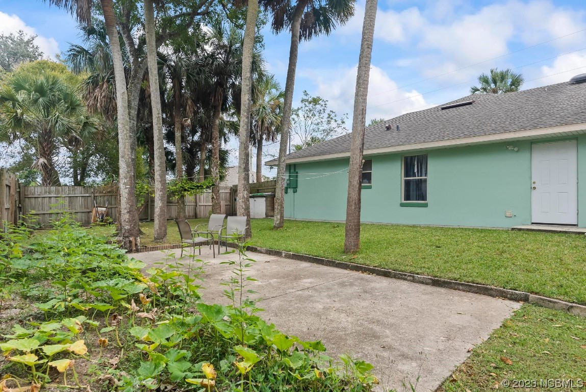 1829 Lime Tree Drive Edgewater, FL 32132 - Photo 41 of 62 a view of a backyard with a garden and plants