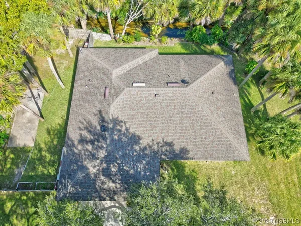 a view of a backyard with couches