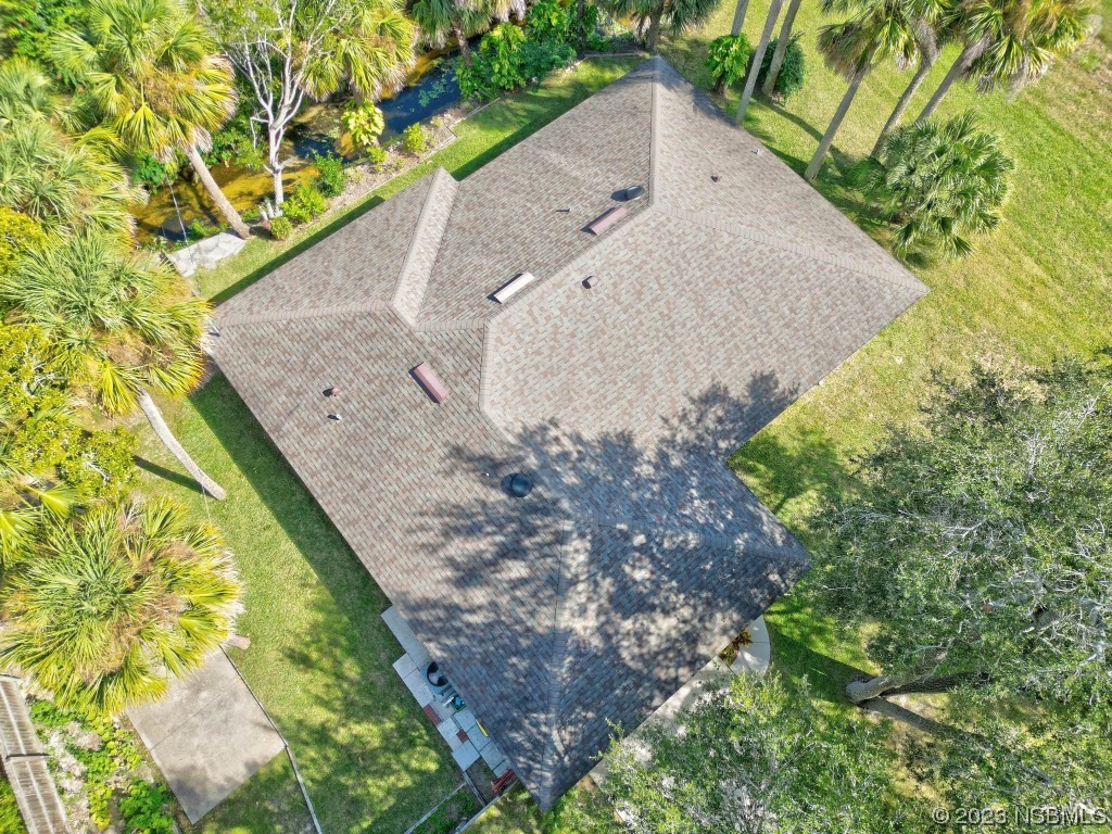 1829 Lime Tree Drive Edgewater, FL 32132 - Photo 51 of 62 a view of a garden with a tree