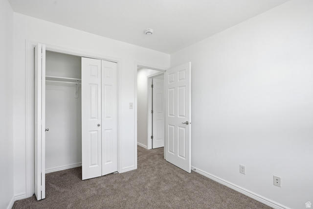 793 North 150 E Street Springville, UT 84663 - Photo 18 of 26 Neutral white walls complement the gray carpeting