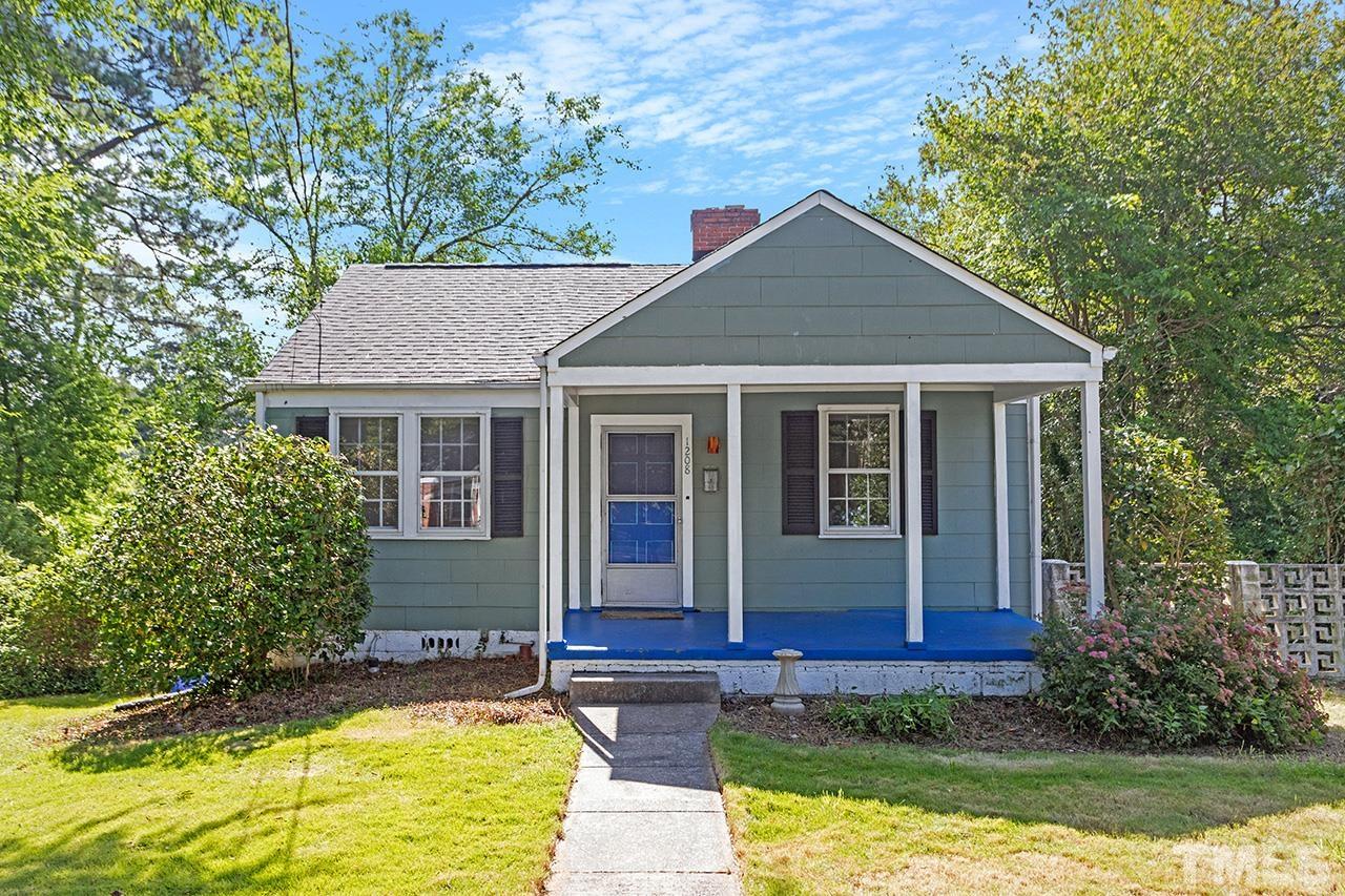 1208 Clifton Street Raleigh, NC 27604 - Photo 1 of 33 a front view of a house with garden