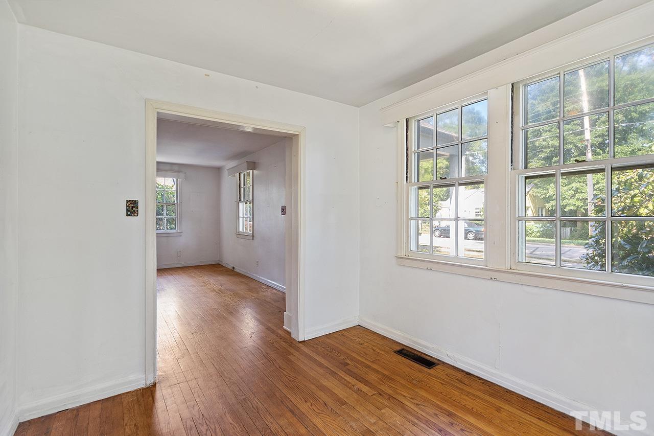 1208 Clifton Street Raleigh, NC 27604 - Photo 14 of 33 an empty room with wooden floor and windows