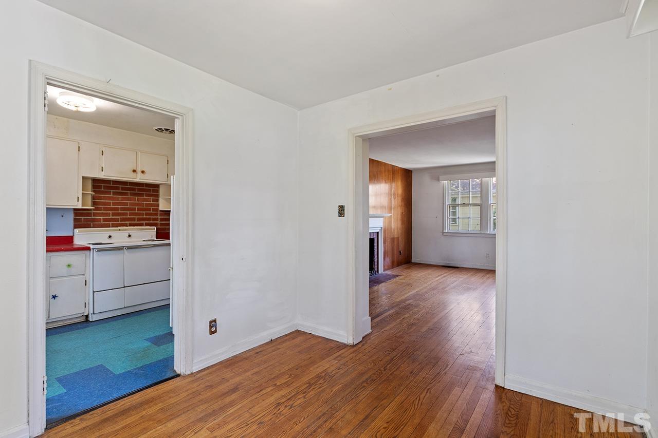 1208 Clifton Street Raleigh, NC 27604 - Photo 15 of 33 a view of a room with wooden floor and cabinet