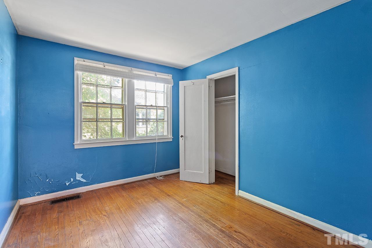 1208 Clifton Street Raleigh, NC 27604 - Photo 21 of 33 an empty room with wooden floor and windows
