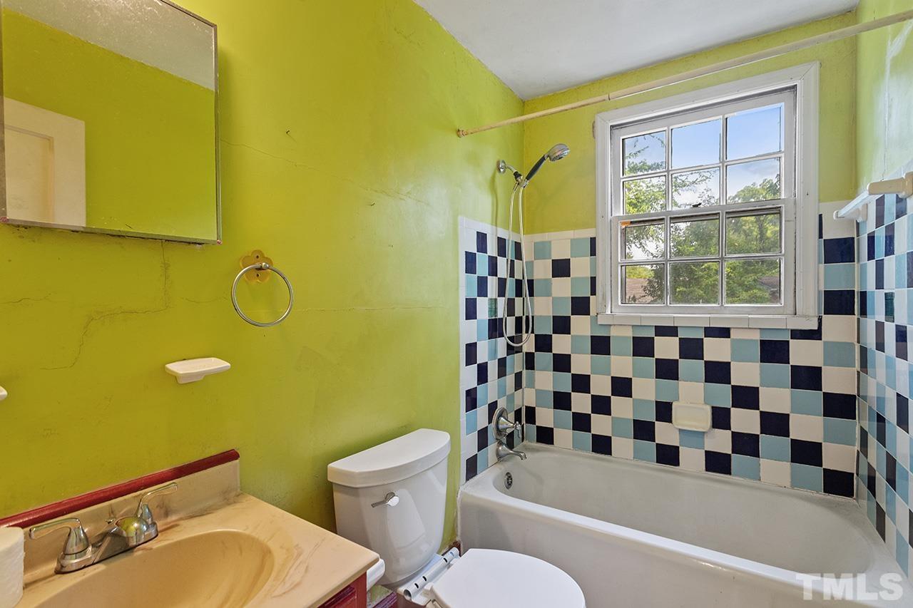 1208 Clifton Street Raleigh, NC 27604 - Photo 28 of 33 a bathroom with a sink mirror bathtub and toilet
