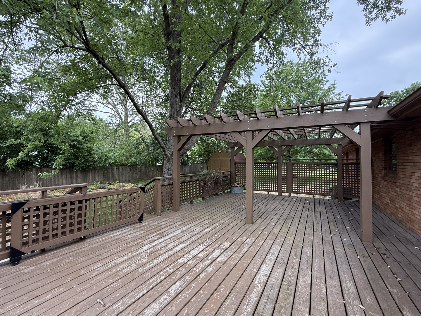 1048 Warren Street Henry, IL 61537 - Photo 8 of 26 a view of backyard with deck and outdoor seating