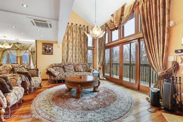 a view of entryway with wooden floor and stairs