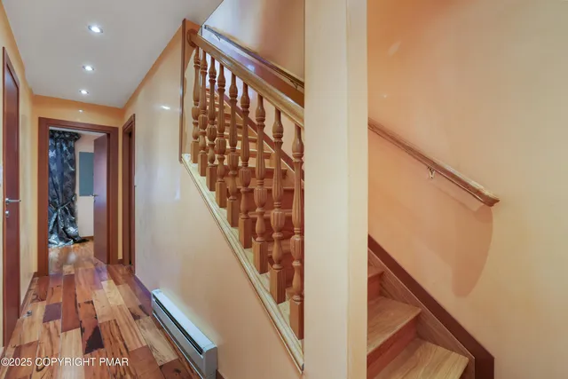 a bedroom with a bed and flat screen tv