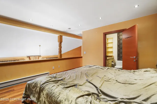 a picture of a room with a white wall and a large window