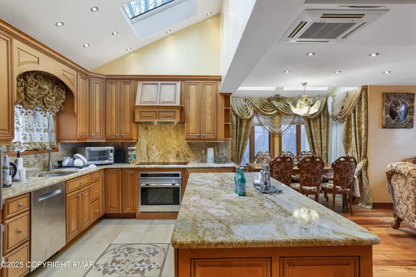 a kitchen with lots of counter top space and appliances