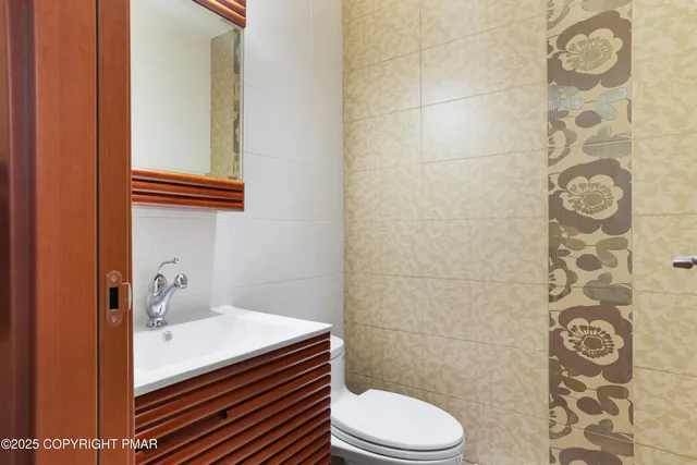 a bathroom with a shower and a sink