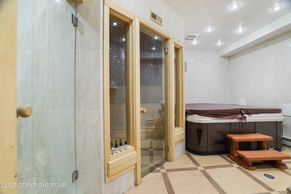 a room with a walk in closet and a bathroom
