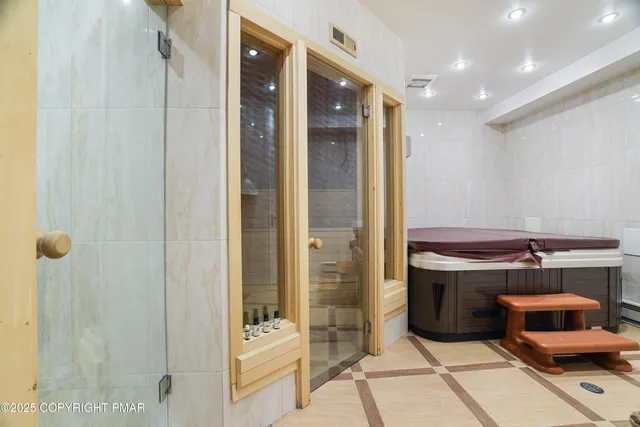 a room with a walk in closet and a bathroom