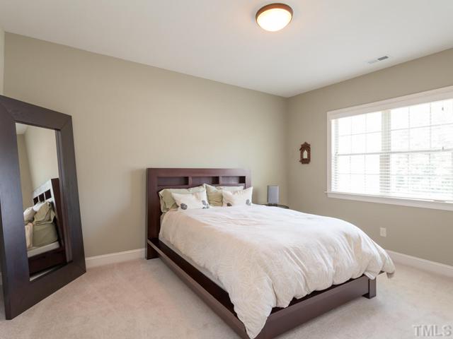 4736 Adler Pass Raleigh, NC 27612 - Photo 13 of 25 Bedroom #3 features a neutral d?cor, window coverings and a large closet.