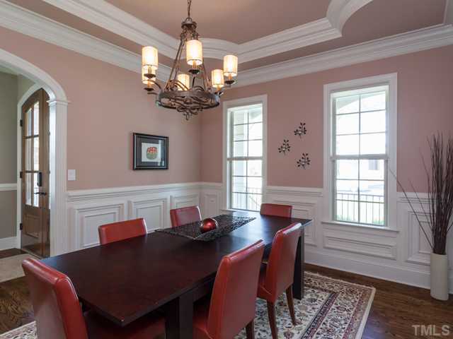 4736 Adler Pass Raleigh, NC 27612 - Photo 3 of 25 The builder of this home is known for the detailed trim work found throughout this custom home. Notice the intricate trey ceiling and the heavy wainscoting in the dining room.