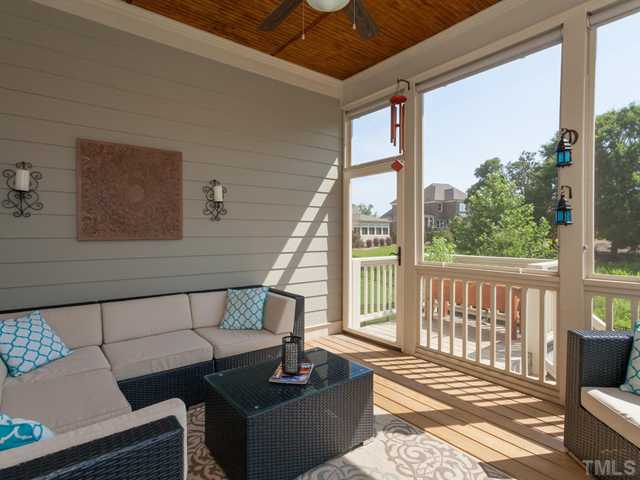 4736 Adler Pass Raleigh, NC 27612 - Photo 8 of 25 The inviting screen porch is just off the breakfast room and overlooks the natural buffer in the backyard.