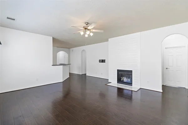 a view of livingroom with hardwood floor and a ceiling fan