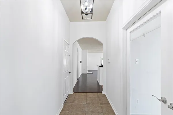 a view of a hallway with a white walls