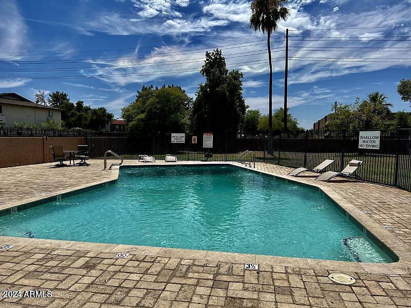 1827 East Kirkland Lane, Unit D Tempe, AZ 85288 - Photo 18 of 21 a view of a swimming pool with a patio