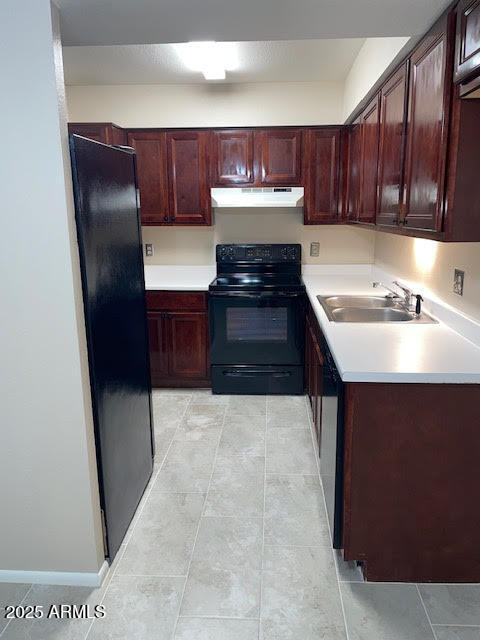 1827 East Kirkland Lane, Unit D Tempe, AZ 85288 - Photo 7 of 21 a kitchen with granite countertop wood cabinets and stainless steel appliances