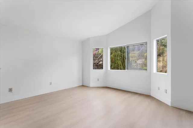 an empty room with closet area