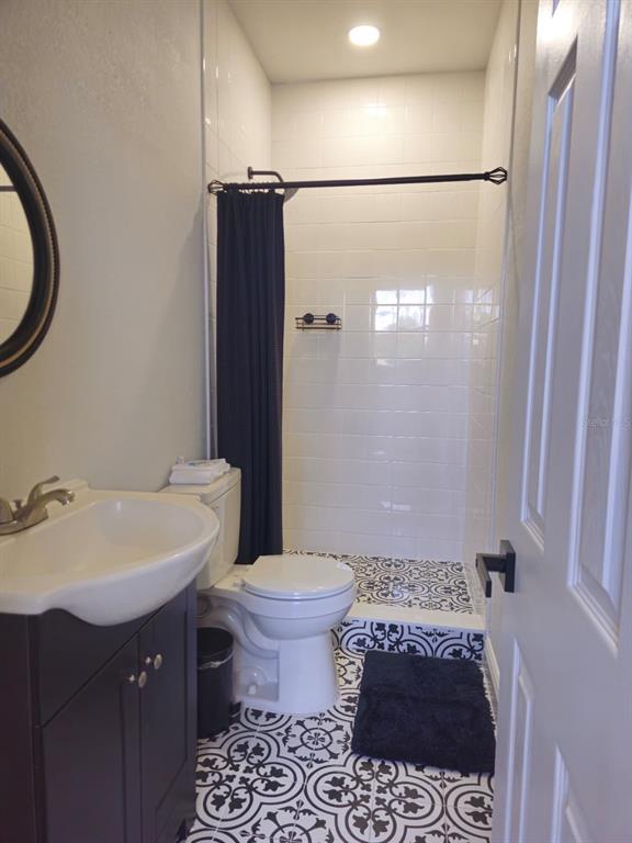 4472 Mariner Road Bonita Springs, FL 34134 - Photo 14 of 36 a bathroom with a sink toilet and shower