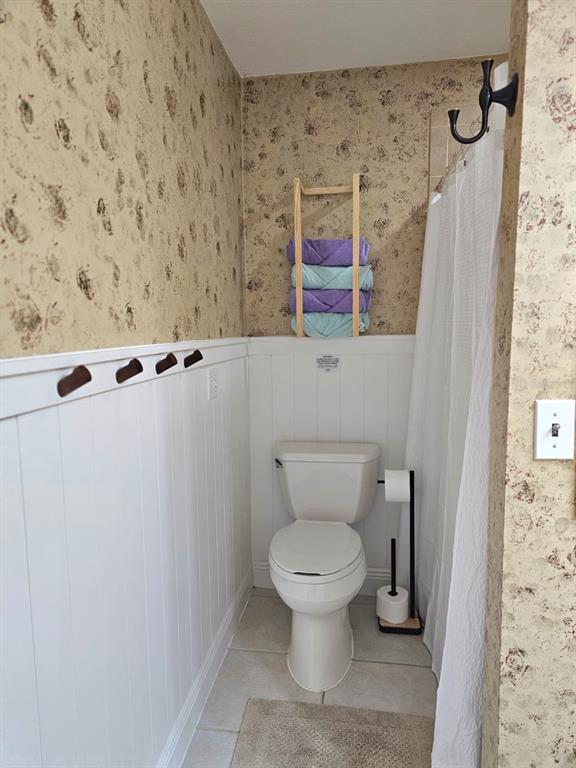 4472 Mariner Road Bonita Springs, FL 34134 - Photo 17 of 36 a bathroom with a toilet and a shower