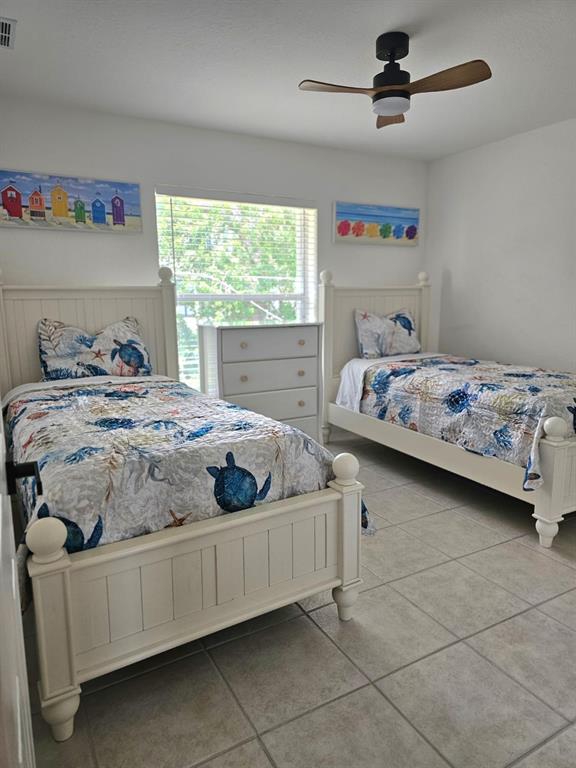 4472 Mariner Road Bonita Springs, FL 34134 - Photo 18 of 36 a bedroom with two beds and window