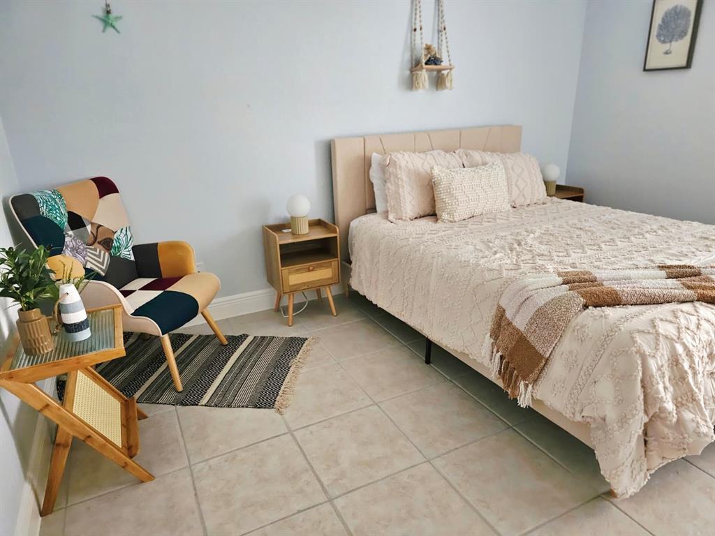 4472 Mariner Road Bonita Springs, FL 34134 - Photo 20 of 36 a bedroom with a bed and dresser