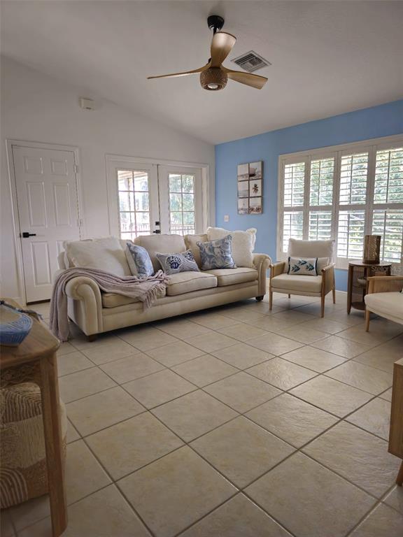 4472 Mariner Road Bonita Springs, FL 34134 - Photo 24 of 36 a living room with furniture and a large window