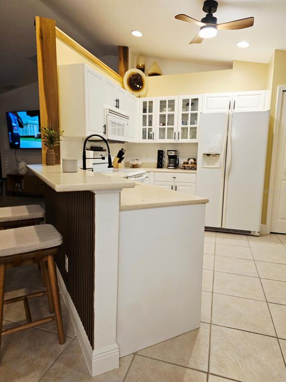 4472 Mariner Road Bonita Springs, FL 34134 - Photo 26 of 36 a view of kitchen with stainless steel appliances granite countertop a sink and a refrigerator