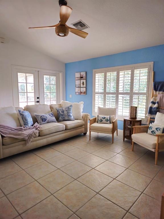 4472 Mariner Road Bonita Springs, FL 34134 - Photo 29 of 36 a living room with furniture and a large window